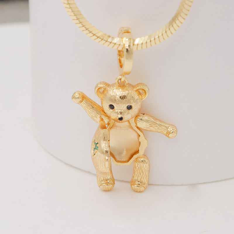 Gold beaded necklace with standing bear pendant charm and small colorful accents