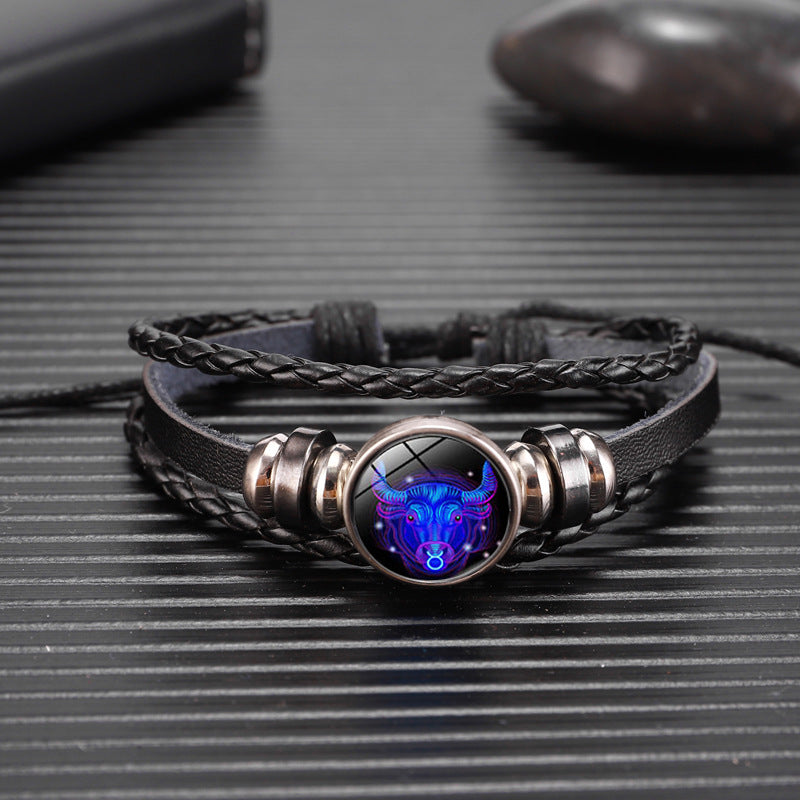 Black braided leather bracelet with luminous blue zodiac oval in silver setting