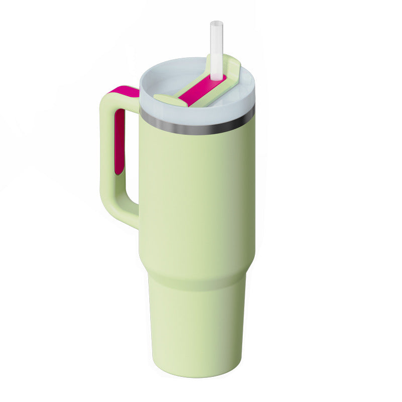 Light green insulated tumbler with side handle, straw, and snap-on lid