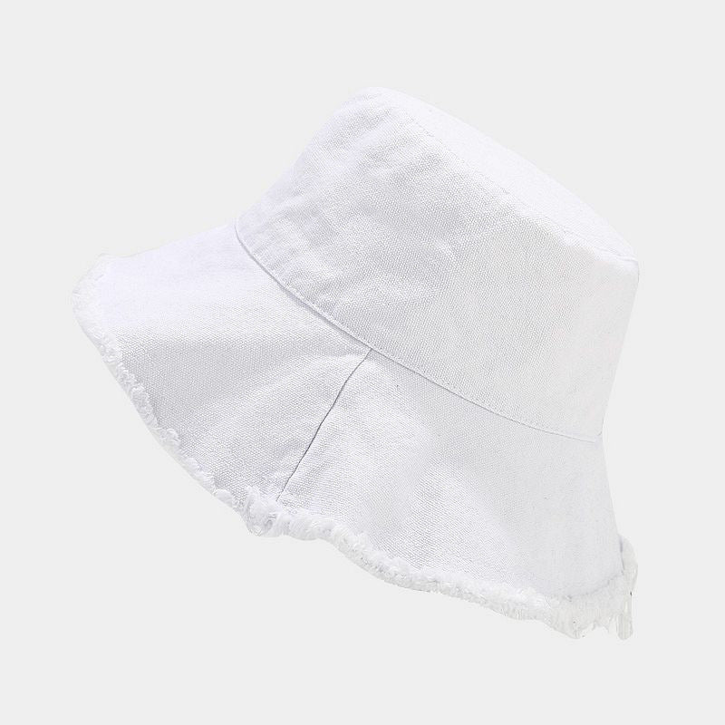 White sun hat with wide brim and lightly frayed edge, bucket-style.