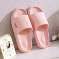 Pink slide slippers with textured upper and thick sole