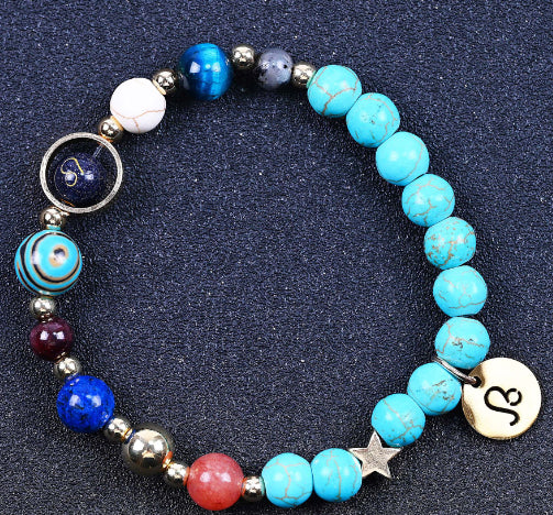 Turquoise beaded bracelet with mixed beads and round zodiac charm disks