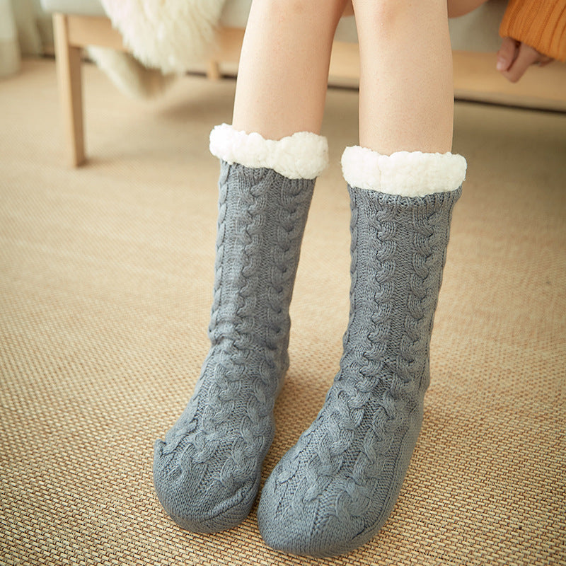 Gray knit fleece socks with fluffy white cuffs and cable-knit pattern