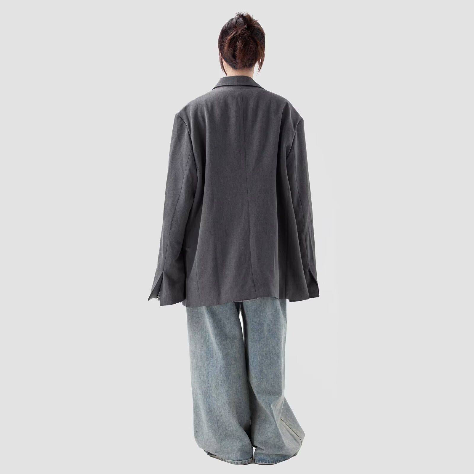 Gray coat back view with long sleeves and relaxed fit