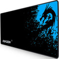 Mouse pad close-up with black and blue dragon graphic, RAKOON logo at lower left