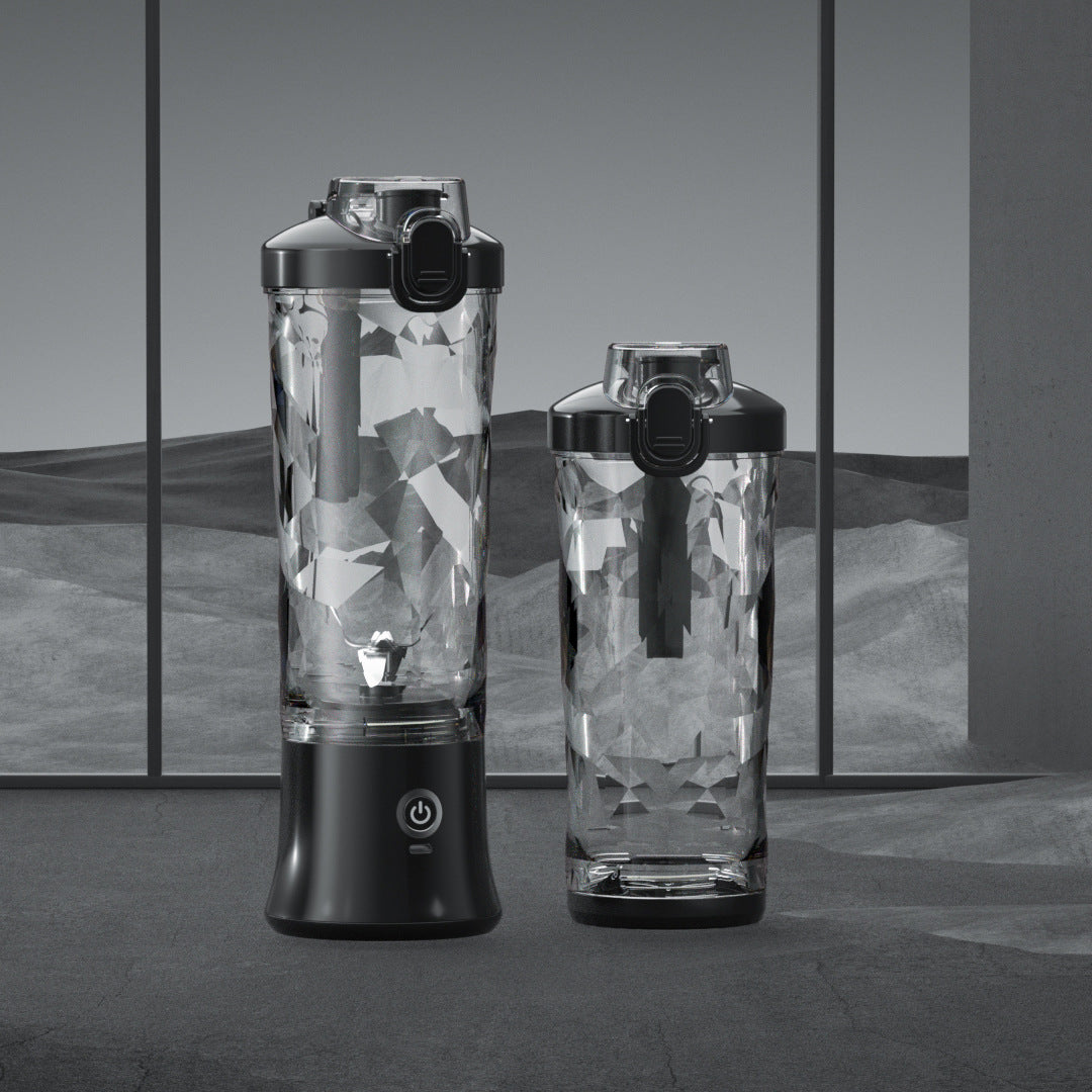 Portable blender with clear blending bottles and black base, shown with second cup