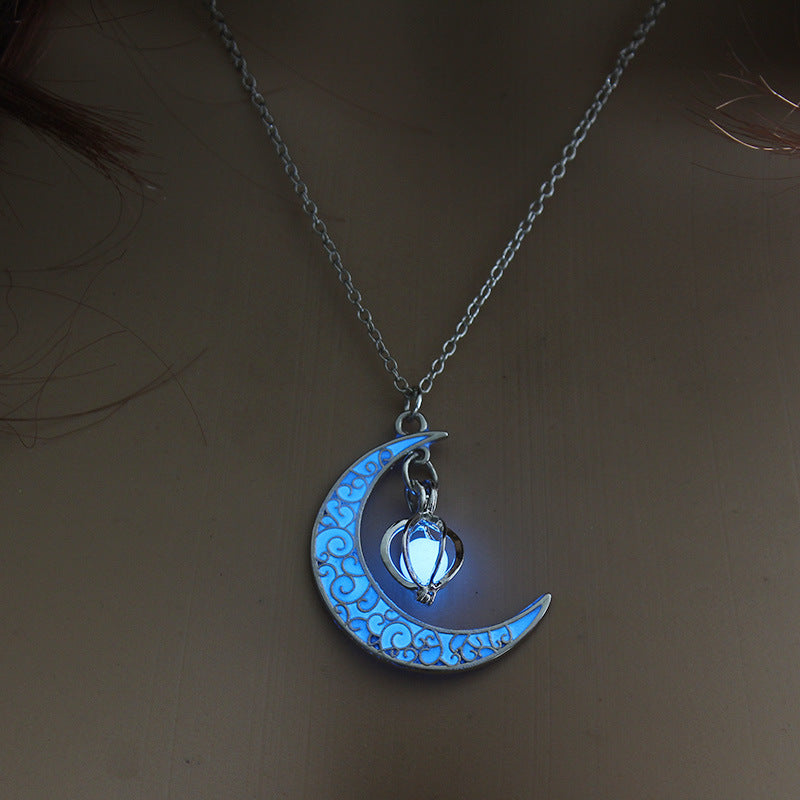 Glowing blue moon pendant with cat lantern charm on silver chain necklace