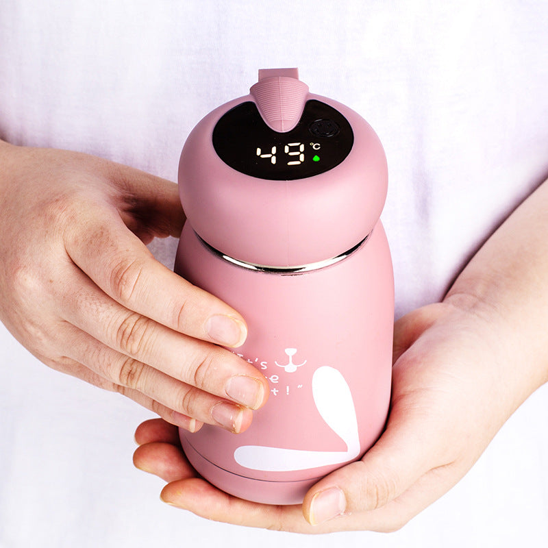 Pink insulated thermos bottle with digital temperature display and side carrying handle