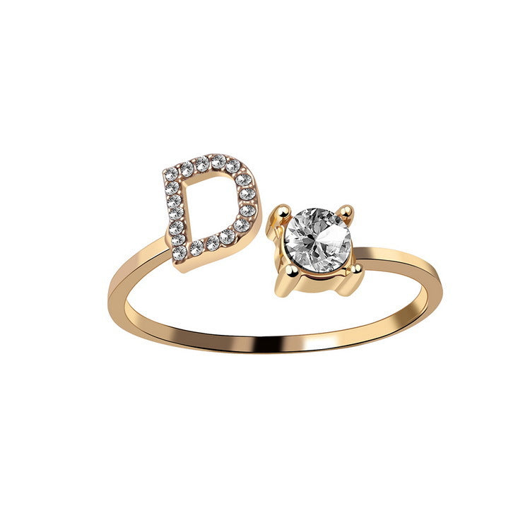 Adjustable initial letter ring with crystal letter detail and round center stone, gold-tone