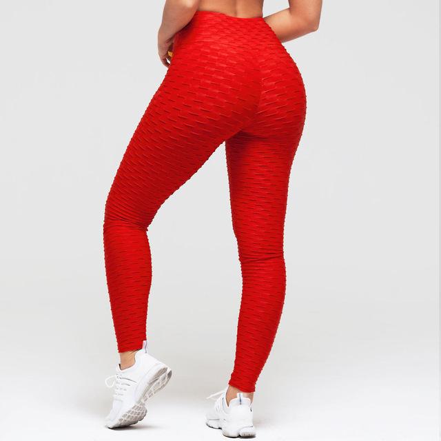 Red scrunch leggings with textured fabric, full length.
