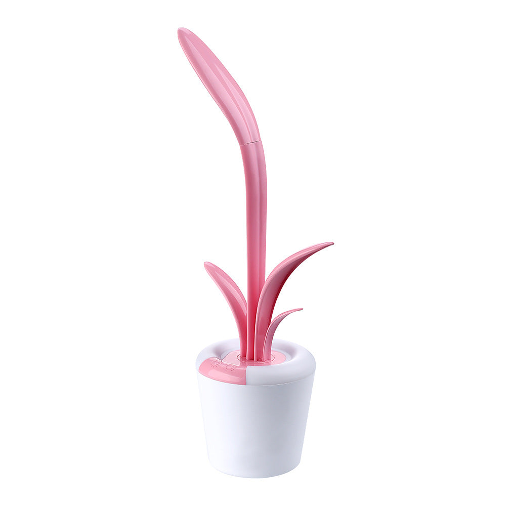 LED table lamp with pink glowing plant stem and small side sprouts; white pot
