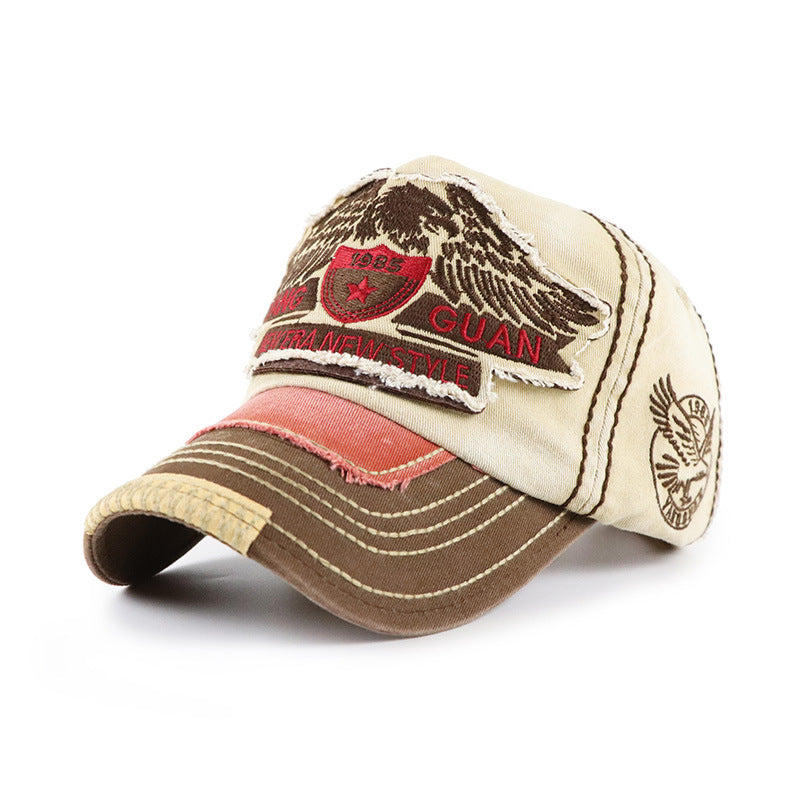Baseball cap in beige and brown with red stitched stripe; front GUAN patch