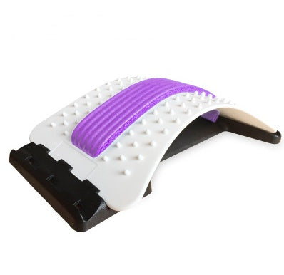 White lumbar traction brace with purple traction strap and textured studded surface.