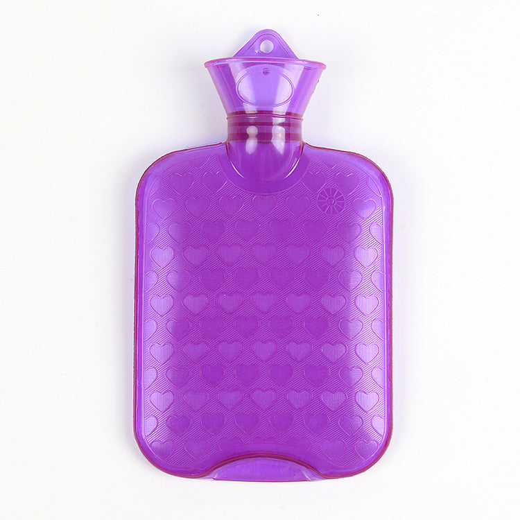 Purple hot water bottle with embossed heart pattern and neck stopper