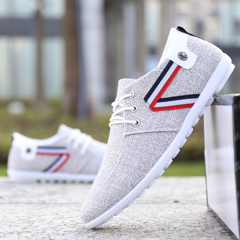 White canvas lace-up shoe with tricolor side panel and white rubber sole