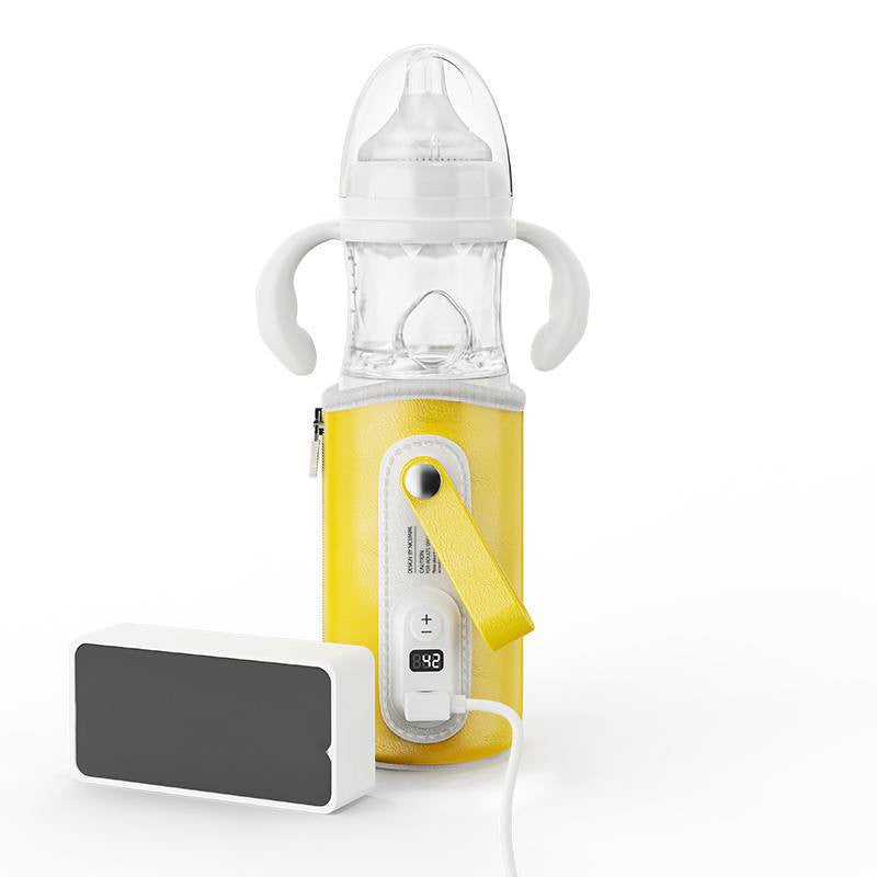 Yellow milk bottle warmer with clear bottle and digital temperature display