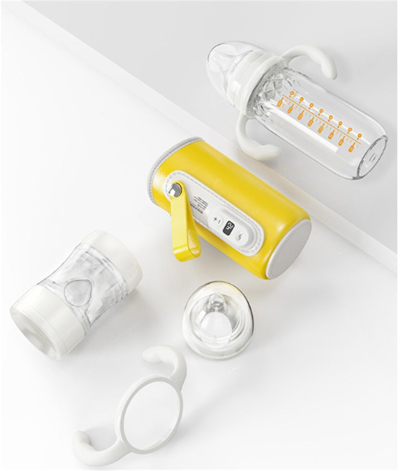 Yellow insulated milk bottle warmer with glass baby bottle and silicone cap set