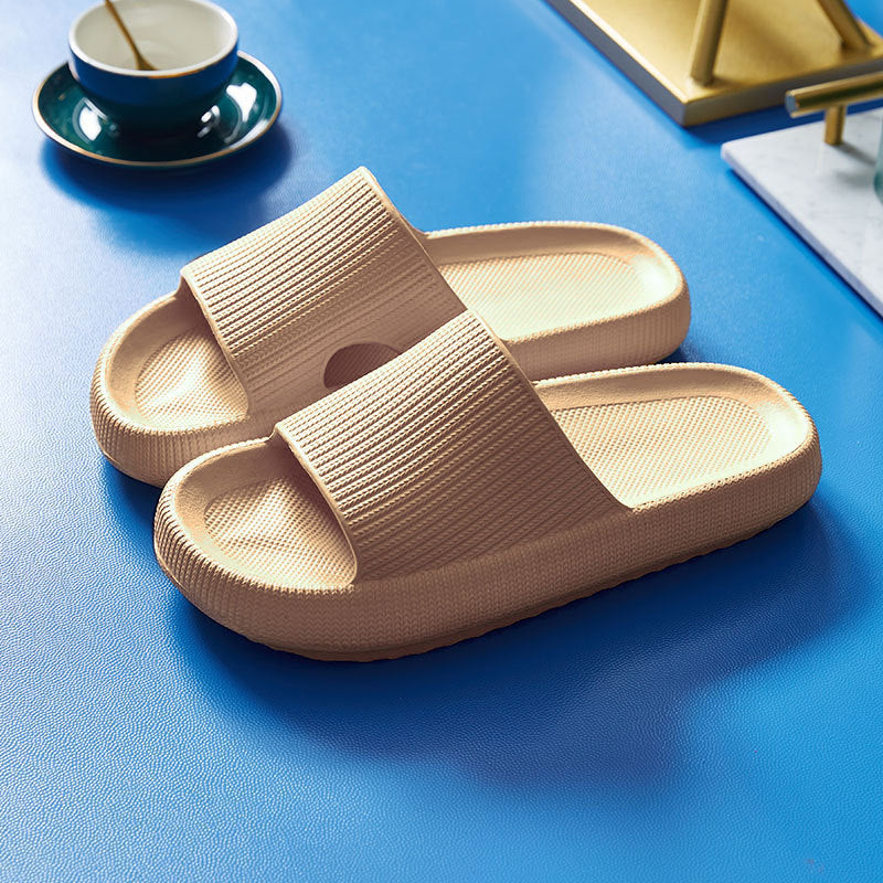 Beige slide slippers with textured wide straps and cushioned sole