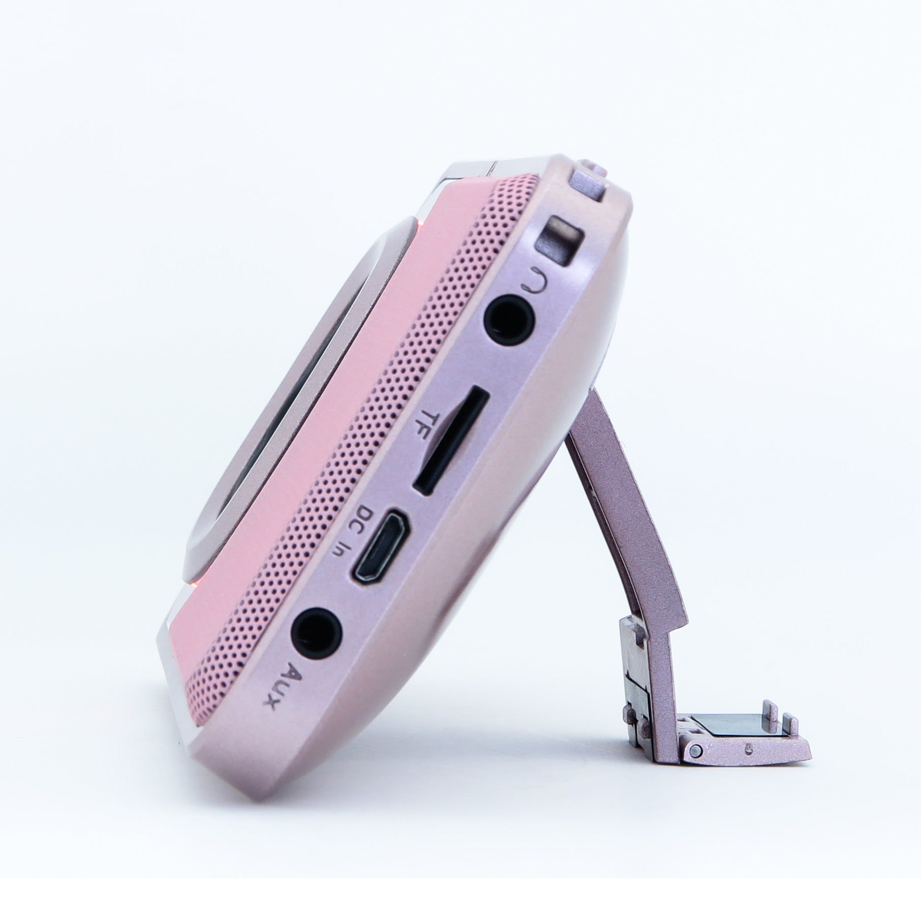 Mini portable Bluetooth speaker, pink side panel with ports and control buttons