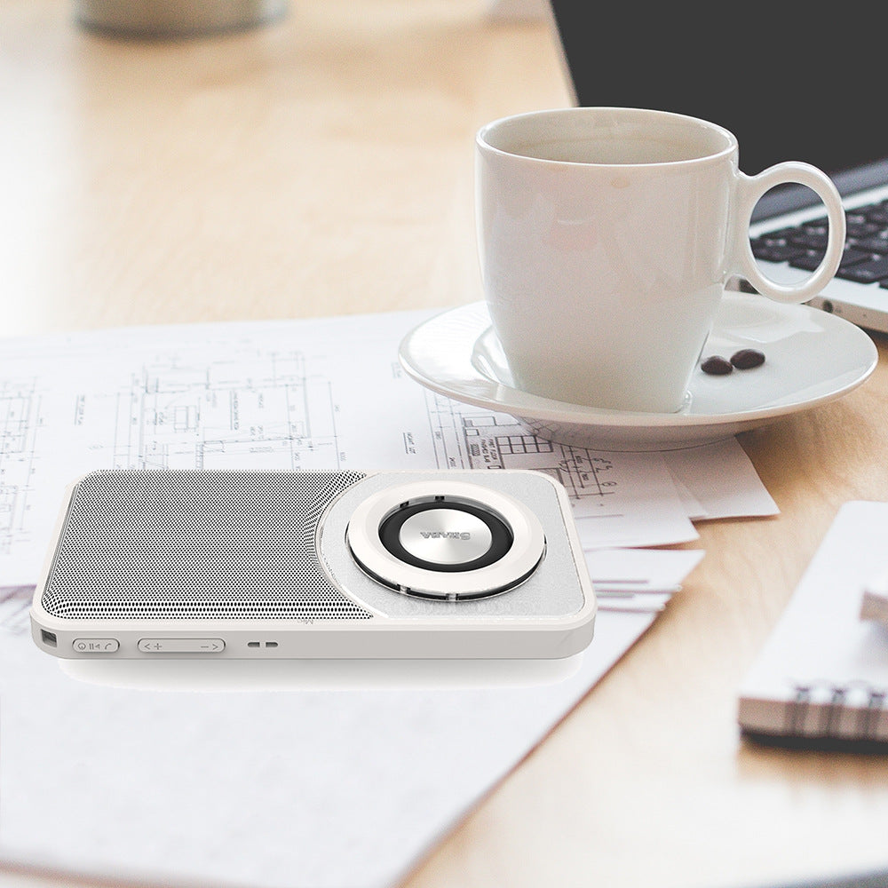 Mini portable Bluetooth speaker, white with round woofer ring and mesh speaker grille
