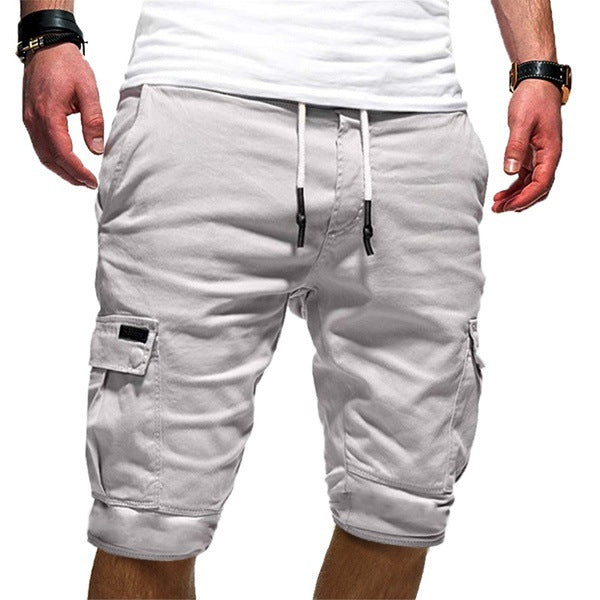 White cargo shorts with drawstring waist and side utility pockets