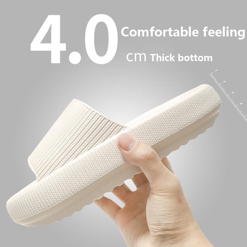 Cream knit slide slippers with open toe and cushioned sole.