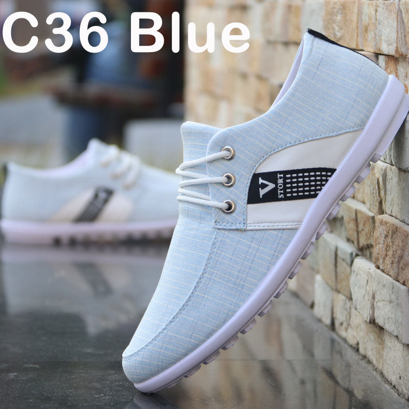 Blue canvas lace-up shoe with black side label and red-blue stripe, white sole
