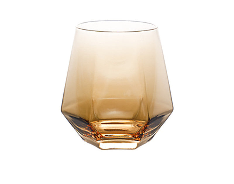 Amber-tinted glass water cup with a faceted octagon base