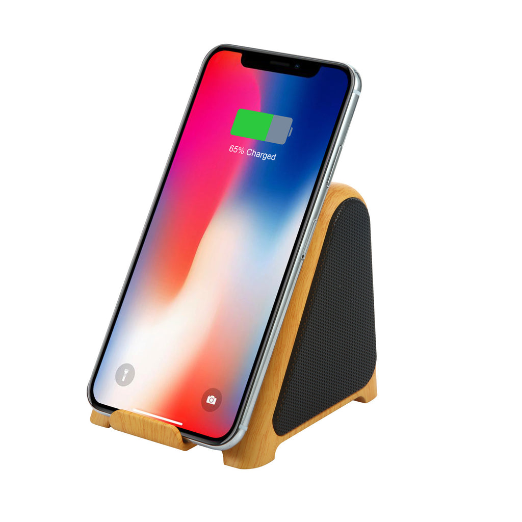 Small wood-grain wireless subwoofer speaker dock with phone resting against the front