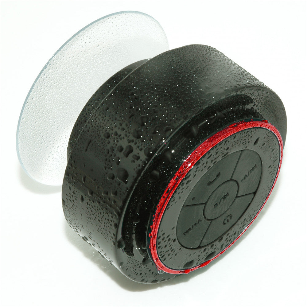 Bluetooth waterproof speaker with white rear cap, black body, and red LED ring