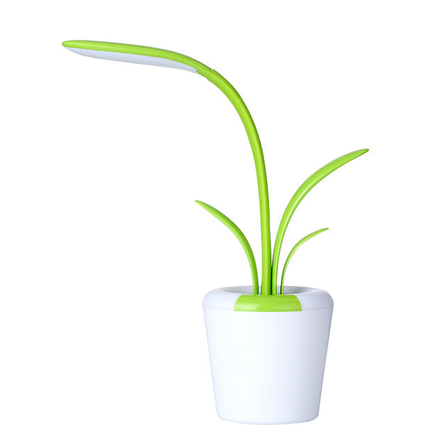 LED table lamp with tall green glowing plant stems and white pot