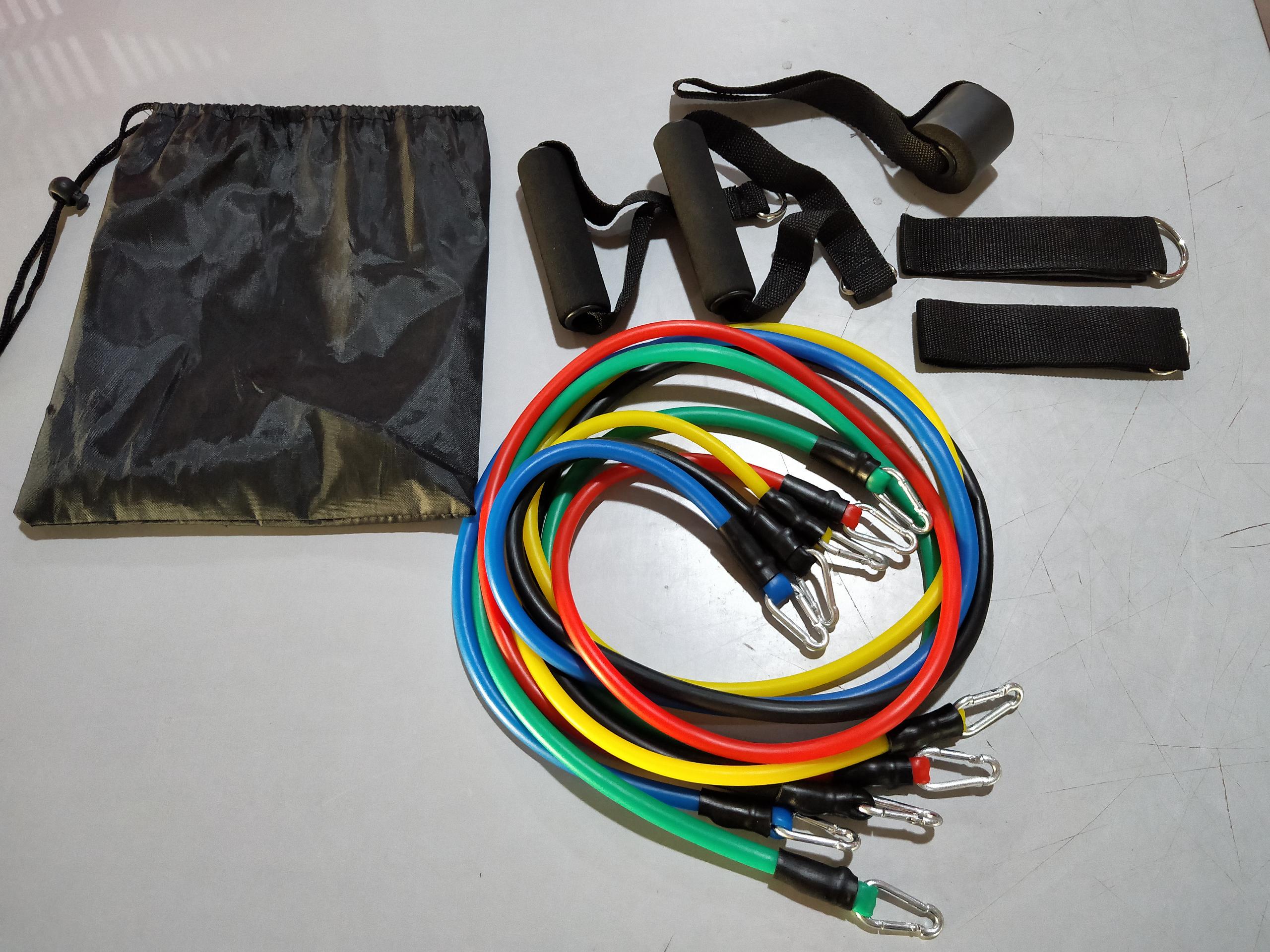 Multicolor resistance rope bands with metal clips and black straps in a storage bag