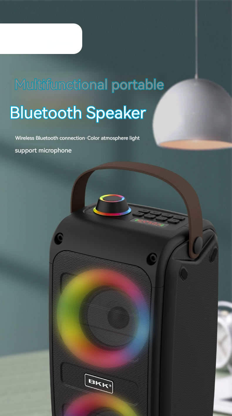 Black portable Bluetooth speaker top section with handle and multicolor light ring.