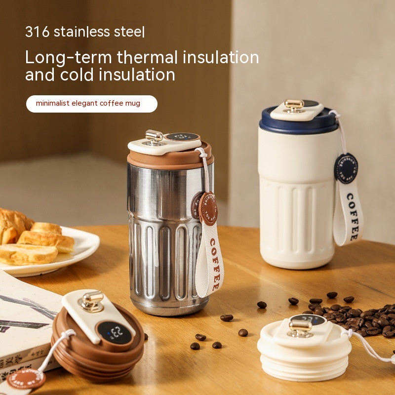 Portable vacuum insulated coffee mug thermos with digital display, white body and brown rim