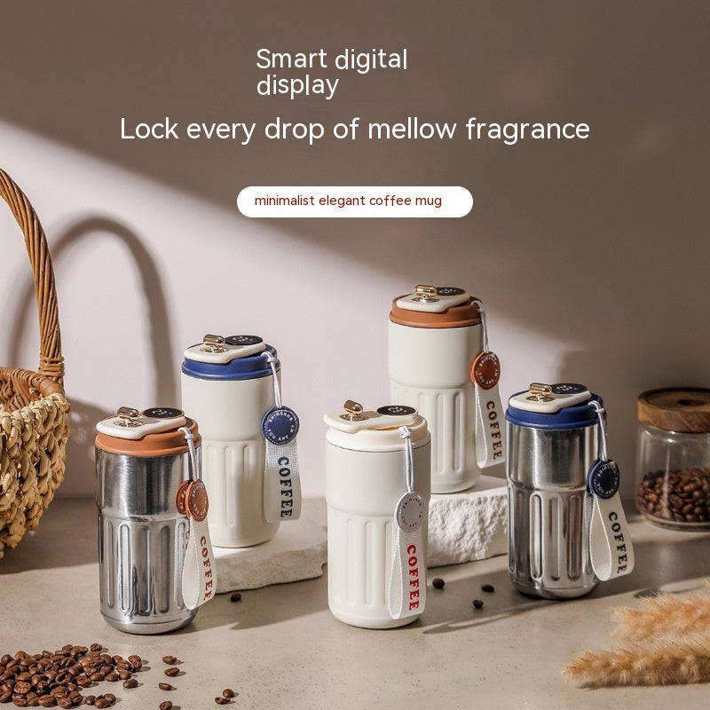 Set of vacuum insulated coffee mug thermos with digital lids in silver, white, and blue