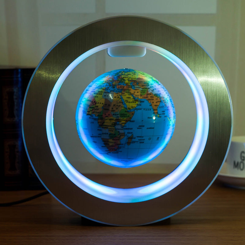 Floating LED world globe with blue lit ring and detailed blue globe map on dark base