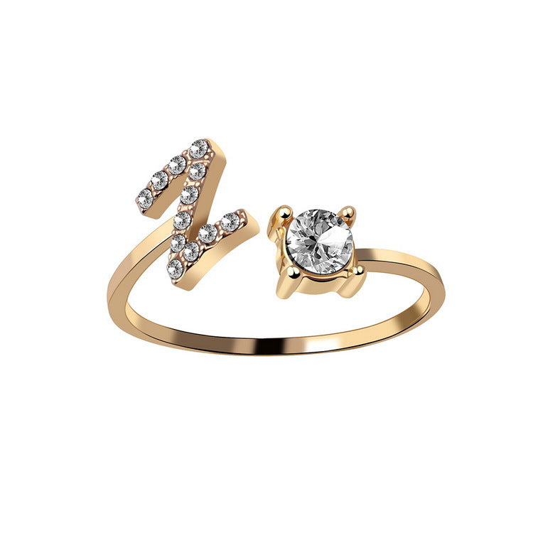 Gold adjustable initial letter ring with round crystal and crystal-set letter