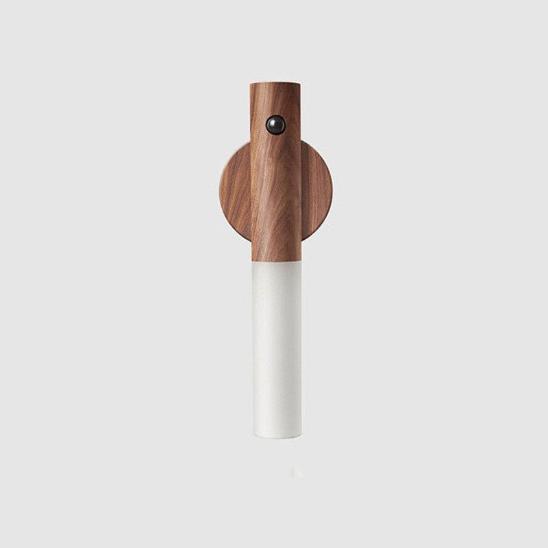Walnut wood magnetic night light with round cap, white cylinder, and sensor dot
