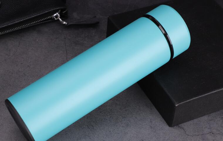 Light blue insulated stainless steel vacuum bottle with dark base ring