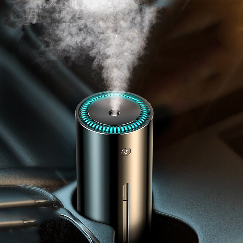Car humidifier diffuser with circular mist nozzle and glowing blue ring