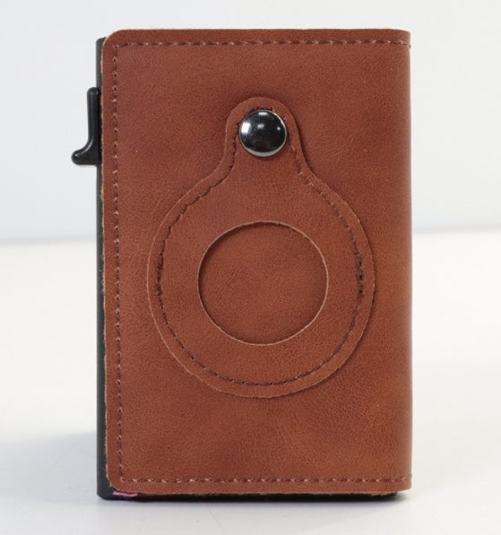 Brown leather card wallet with circular AirTag cutout and metal snap button