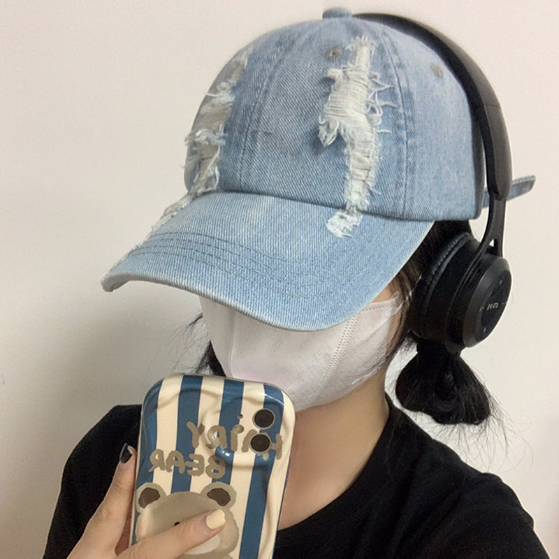 Light blue denim baseball cap with distressed front and curved brim