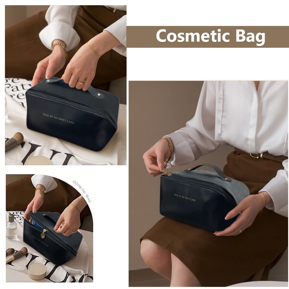 Navy cosmetic bag with top handle and front zipper, held closed in hand