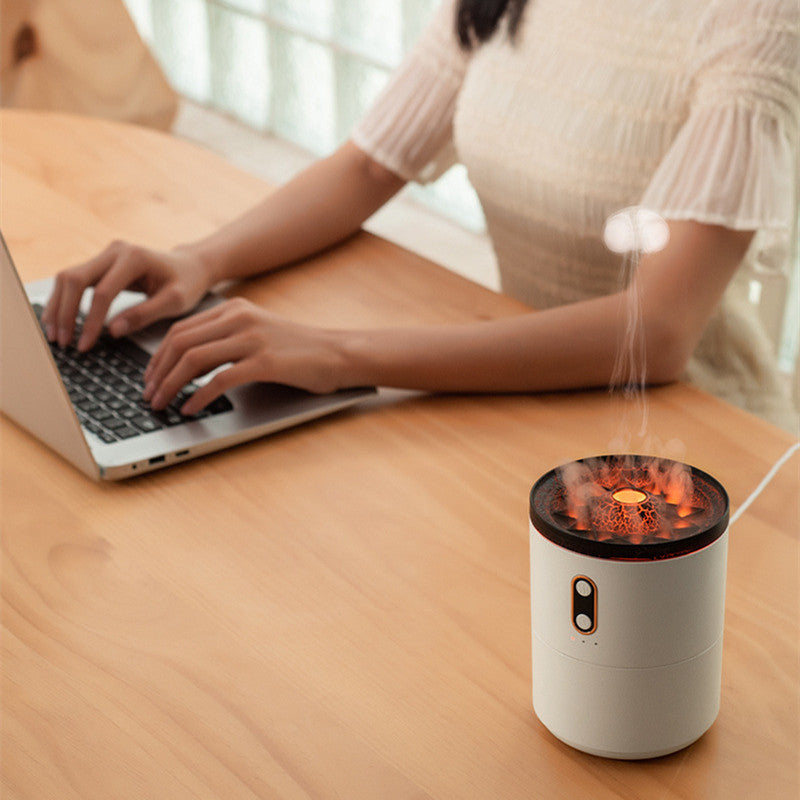USB aroma diffuser humidifier, white cylinder with warm flame-like light and mist