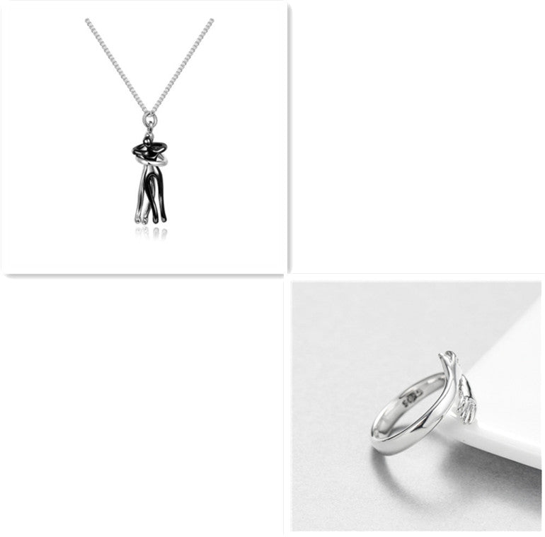 Black-tone hug pendant necklace with heart charm and chain, unisex.