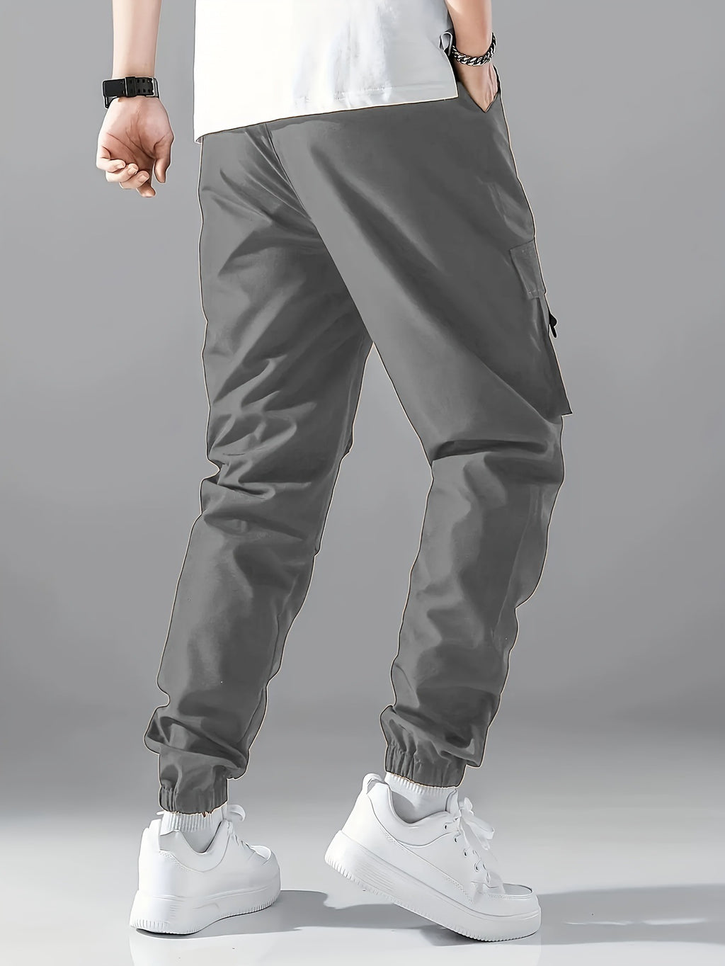 Gray cargo jogger pants with side utility pockets and cuffed ankles