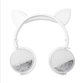 White cat-ear headphones with clear glitter ear cups and soft headband