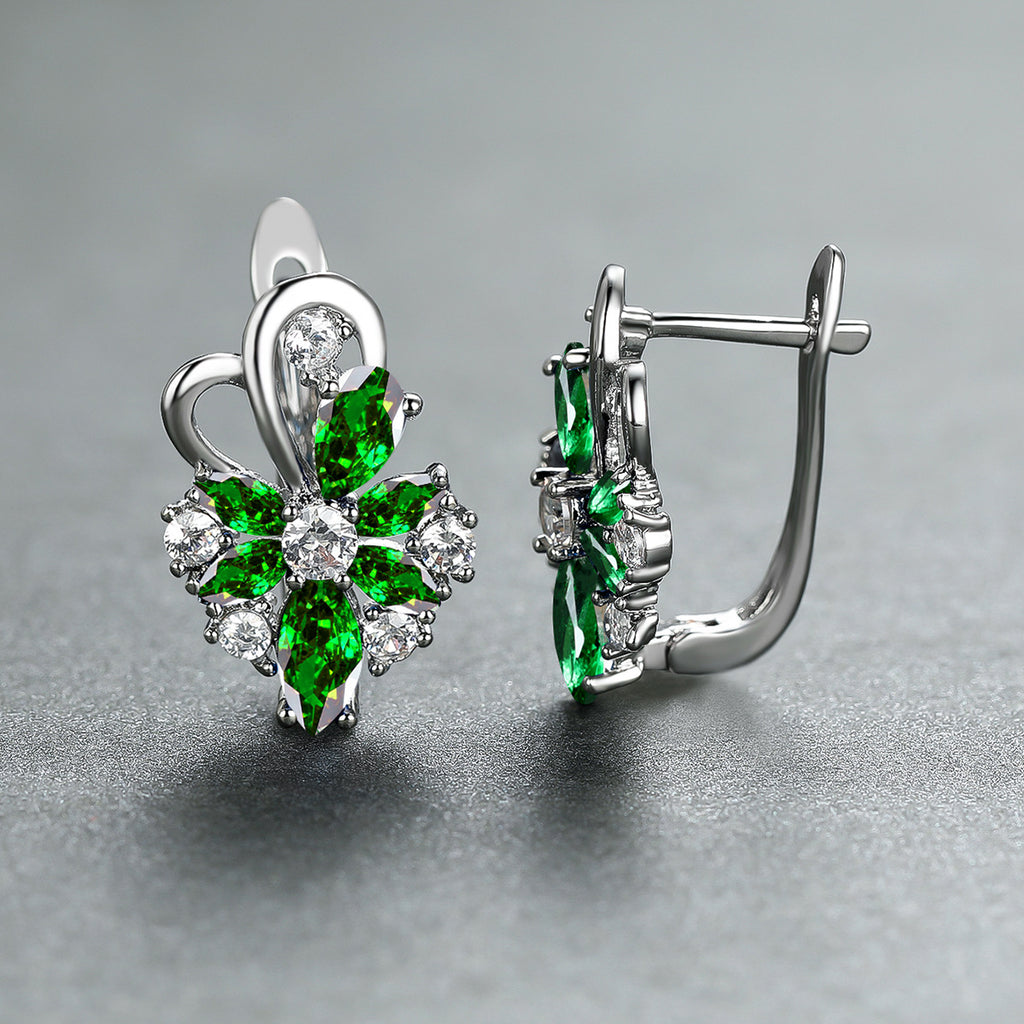 Silver-tone drop earrings with green marquise and pear stones, clear halo accents