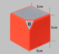 Orange Rubik's Cube Bluetooth speaker front face with top grille and small side port