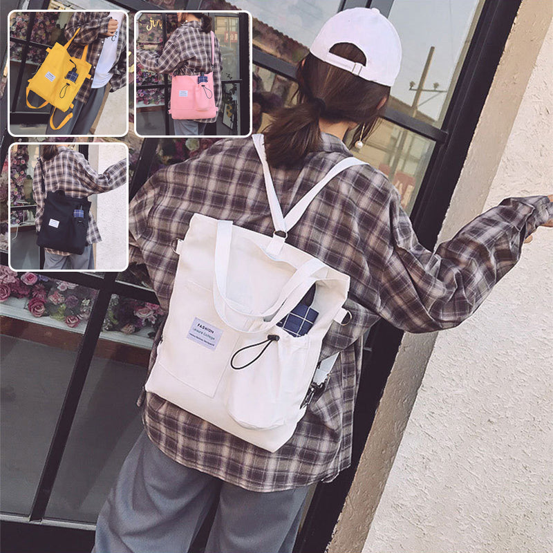 White canvas tote backpack with front pocket and drawstring, plaid patch detail